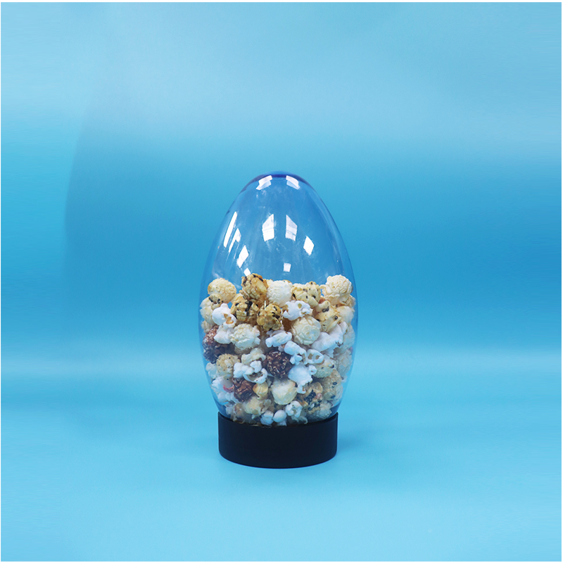 Einzigartige Ei-förmige Kunststoff-Süßigkeiten Popcorn Pistazien-Nuss-Süßigkeiten-Glas Upside Down Flat Cap